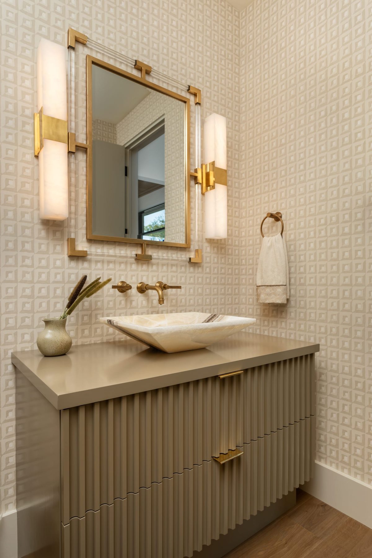 Fluted floating vanity with brass pulls