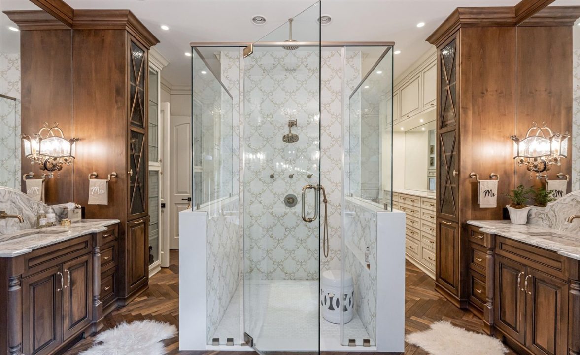 His-and-hers vanities with matching linen towers